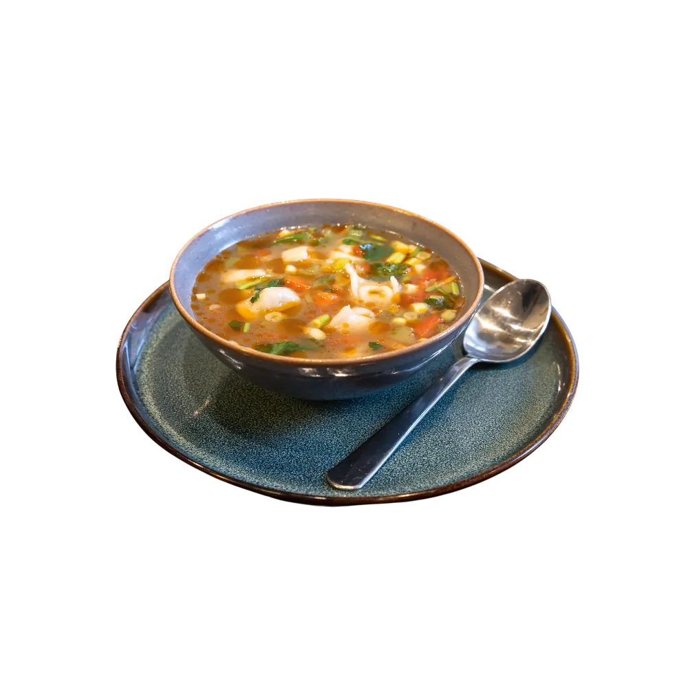 Chöchör-style Uyghur noodle soup with vegetables served in a dark bowl 