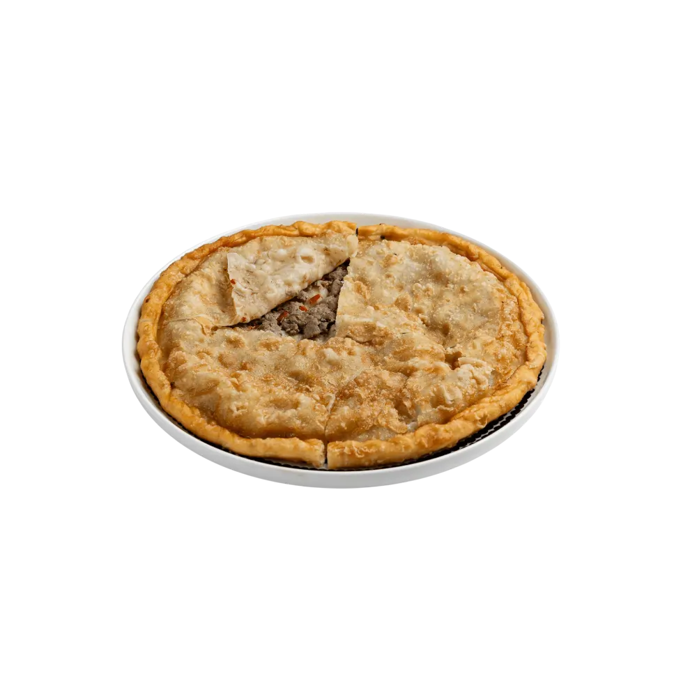 Traditional Uyghur göshnan meat pie filled with beef and vegetables