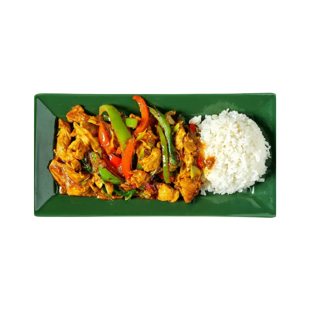 Spicy stir-fried chicken with peppers and steamed rice on a green plate